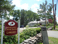 A sign on the side of a treeDescription generated with very high confidence